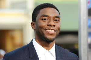 LOS ANGELES, CA - APRIL 07: Actor Chadwick Boseman attends the premiere of "Draft Day" at Regency Bruin Theatre on April 7, 2014 in Los Angeles, California. (Photo by Jason LaVeris/FilmMagic)